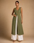Olive green cotton front-slit kurti front view with carved terracotta buttons, styled with cream palazzo - Vanya by Kavyaantra
