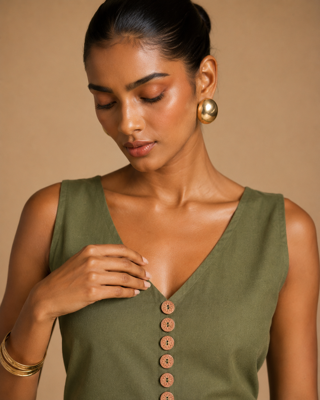 Close-up of olive green kurti deep V-neck and hand-carved terracotta clay buttons - Vanya by Kavyaantra