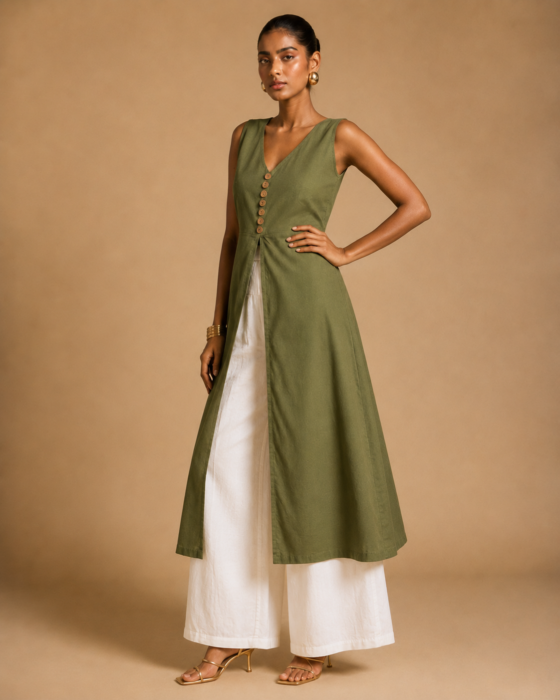 Olive green cotton front-slit kurti editorial view with carved terracotta buttons - Vanya by Kavyaantra