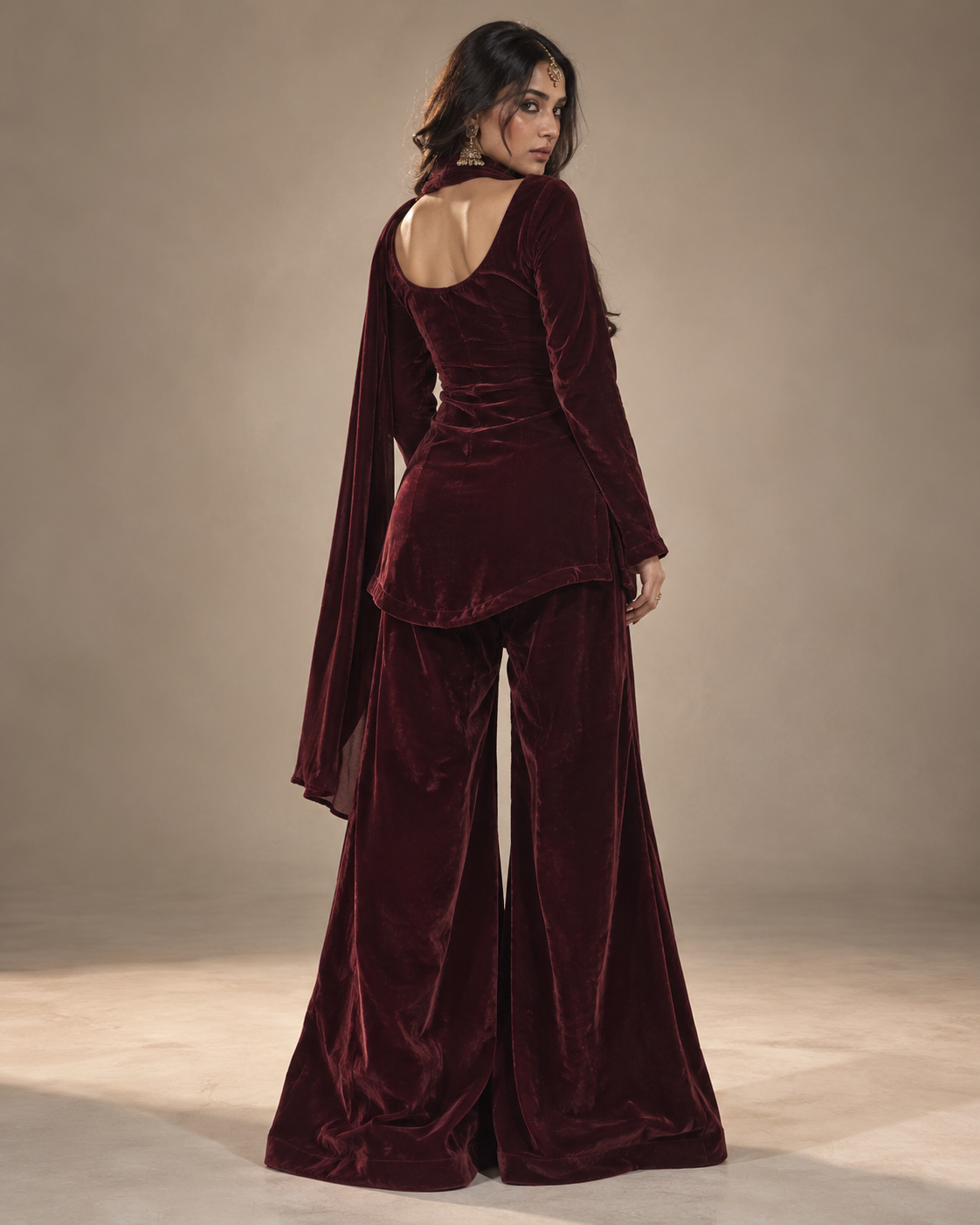 Gul deep maroon velvet sharara set back view with apple-cut kurti hem – Kavyaantra