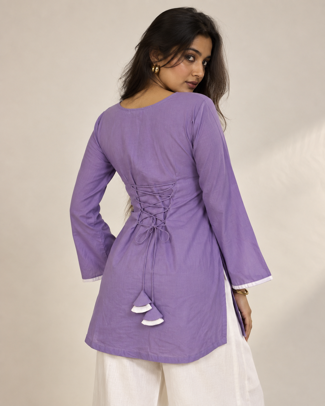 Inaya lavender cotton kurti with bell sleeves and white detailing styled with white palazzo